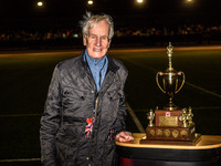 Ove Fundin, the former five-time World Speedway Champion, is posing with the Peter Craven Memorial Trophy during the Peter Craven Memorial T...