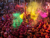 Hindu devotees are gathering at Nandbhavan Mandir in Mathura, Nandgaon Rural, Uttar Pradesh, India, on March 19, 2024, to play Holi by throw...