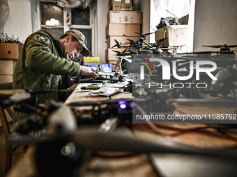 A serviceman is assembling a reusable bomber drone in Zaporizhzhia, Ukraine, on March 8, 2024. NO USE RUSSIA. NO USE BELARUS. (