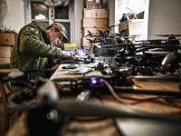 A serviceman is assembling a reusable bomber drone in Zaporizhzhia, Ukraine, on March 8, 2024. NO USE RUSSIA. NO USE BELARUS. (Photo by Ukri...