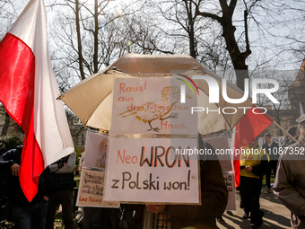 Polish flags and anti-government banners are seen during a protest in front of the regional administration office in the centre of Krakow, t...