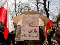 Polish flags and anti-government banners are seen during a protest in front of the regional administration office in the centre of Krakow, t...