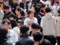 College students are looking for jobs at a spring job fair at Siyuan Square on the Xiangshan campus of Huaibei Normal University in Huaibei,...