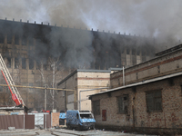 A private enterprise in Kharkiv, north-eastern Ukraine, is experiencing the aftermath of a rocket attack by Russian troops on March 20, 2024...