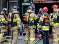 Firefighters are extinguishing a fire that has broken out at the commercial complex of Yeouido Gongjak Apartments in Seoul, South Korea, on...