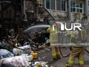 Firefighters are extinguishing a fire that has broken out at the commercial complex of Yeouido Gongjak Apartments in Seoul, South Korea, on...