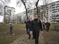 Ivan Fedorov, the head of the Zaporizhzhia Regional Military Administration, is standing outside a multi-storey residential building that is...