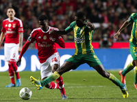 Benfica's defender Nelson Semedo (L) vies for the ball with Tondela's midfielder Helder Tavares (R)  during the Portuguese League football m...