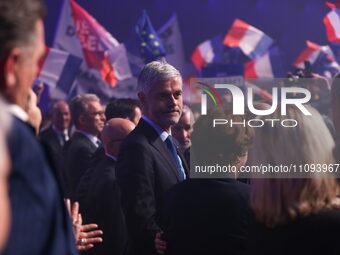Laurent Wauquiez, a member of the French right-wing party Les Republicains (LR), is listening to speeches during the party's campaign launch...