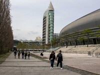 Several people are walking near the Altice Arena in the Oriente district, in Lisbon, Portugal, on March 13, 2024. (