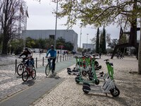 People are engaging in outdoor activities near Das Nacoes Park in the Oriente district of Lisbon, Portugal, on March 13, 2024. (