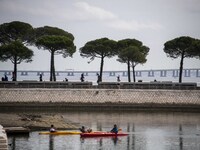 People are engaging in outdoor activities near Das Nacoes Park in the Oriente district of Lisbon, Portugal, on March 13, 2024. (