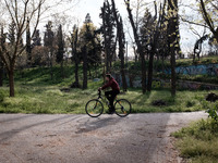 A man is riding his bicycle in Larissa, Greece, on March 24, 2024. Cities that provide space for pedestrians and bicycles are becoming frien...