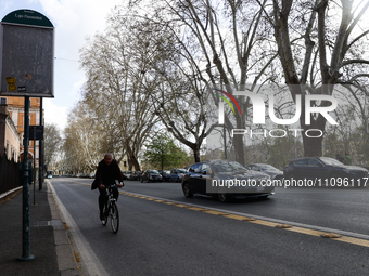 A person on a bike rides a street in Rome, Italy on March 24, 2024. (