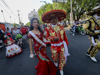 Participants are dressed in traditional Charro suits and are taking part in the Comparsa Faisanes as part of the closing of the Annual Santa...