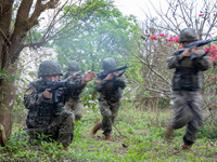 Armed police officers are conducting a mountain forest tactics training in Beihai, China, on March 25, 2024. (