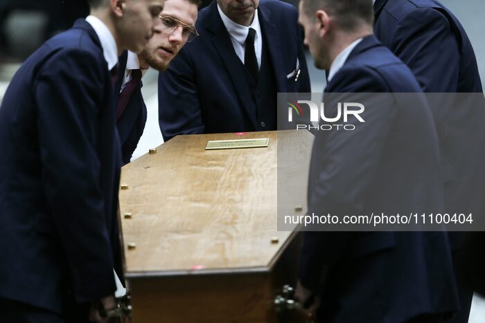 Members of the public are looking at the coffin of France's former Minister of Culture, writer, and TV host Frederic Mitterrand as it is bei...