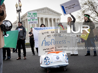 Pro-choice activists demonstrate at the Supreme Court before it hears oral arguments in a case that could end access to the abortion medicat...
