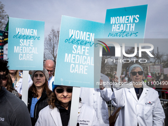 Doctors participate in an anti-abortion demonstration at the Supreme Court as it hears oral arguments in a case that could end access to med...