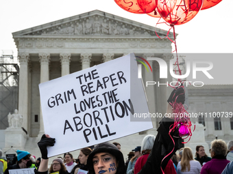 An anti-abortion activist dressed as the Grim Reaper demonstrates at the Supreme Court before it hears oral arguments in a case that could e...