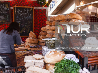 Court bread stand at the traditional Easter Market at the Main Square in Krakow, Poland on March 26th, 2024. Colourful Easter eggs, handmade...