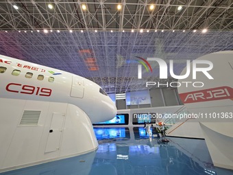 A prototype of the C919 passenger jet is being displayed at the COMAC Shanghai Aircraft Design and Research Institute in Shanghai, China, on...