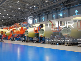 Workers are assembling the ARJ21 passenger aircraft on the production line at COMAC Shanghai Aircraft Manufacturing Co LTD in Shanghai, Chin...