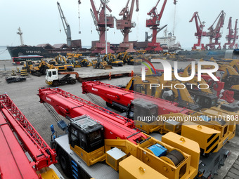 A large number of excavators are being prepared for export at the port of Lianyungang in Jiangsu Province, East China, on March 27, 2024. (