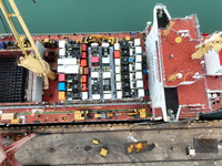Cargo ships are stopping at a berth to load vehicles for export at the terminal in Lianyungang, East China's Jiangsu province, on March 27,...