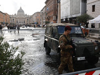 Italian army soldier is seen at Via della Conciliazione,
with a view of the Saint Peter's Basilica in the background, in Vatican, in Rome, I...