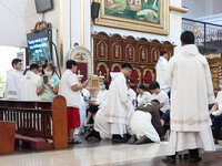 Franciscans and laypeople are participating in the washing of the feet at the Franciscan-run Basilica Minore de San Pedro Bautista in Quezon...