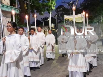 Altar servers are marching outside the Franciscan-run Basilica Minore de San Pedro Bautista for the overnight vigil prayer in Quezon City, P...