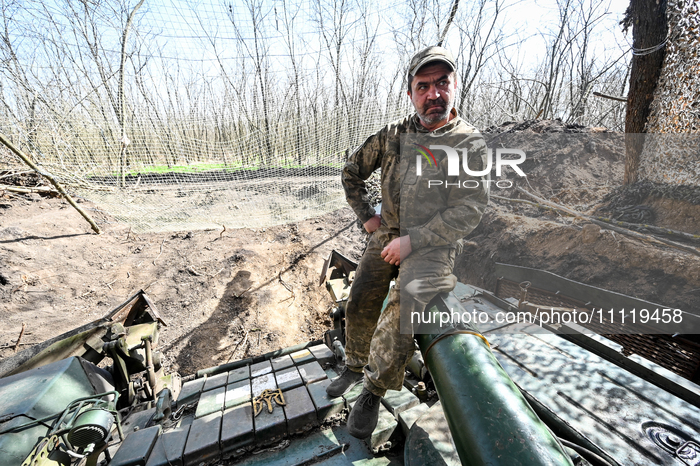 A serviceman from the 1st Tank Brigade of the Ukrainian Ground Forces is sitting on a tank gun in Ukraine, on March 31, 2024. (Photo by Ukri...