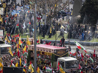 A truck is carrying the coffins of the Islamic Revolutionary Guard Corps' (IRGC) Quds Force members and commanders during a funeral in Tehra...