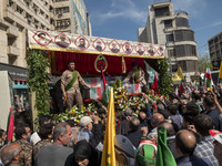 A truck is carrying the coffins of the Islamic Revolutionary Guard Corps' (IRGC) Quds Force members and commanders during a funeral in Tehra...