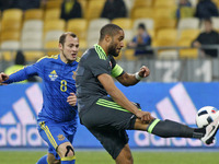 Roman Zozulya (L) of Ukraine national football team in action against Ashley Williams (R) of Wales national football team,during the friendl...