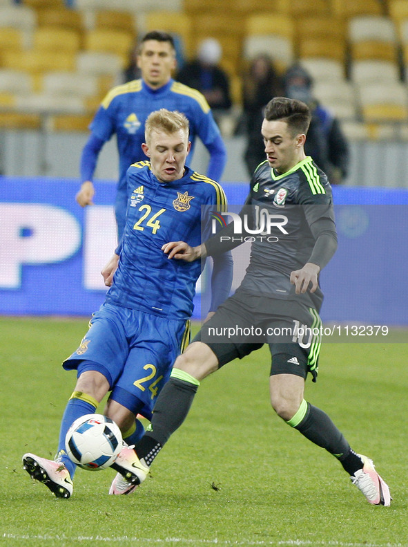 Viktor Kovalenko  (L) of Ukraine national football team in action against Tom Lawrence (R) of Wales national football team,during the friend...