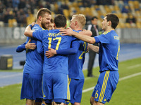 Andriy Yarmolenko (L) and players of Ukraine national football team celebrate a goal,during the friendly football match between Ukraine and...