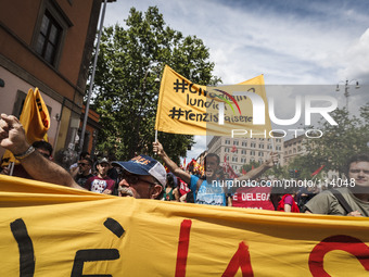 Rome, Italy – May 17, 2014: Protesters shout slogans and hold banners during a nationwide demonstration against the privatization of the com...
