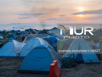 Sunrises over tents in Idomeni camp on April 6, 2016. A plan to send back migrants from Greece to Turkey sparked demonstrations by local res...