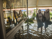 Two student studying in flooded  high school SMKN 1, Village Kramat Sari, Pekalongan, Central Java, Indonesia, on April 11, 2016. The floods...
