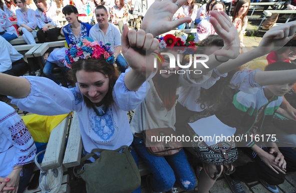 Hundreds of Ukrainians cheers several traditional music entertainment  music festival in Mariinsky Park on a hot Spring afternoon. 