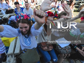 Hundreds of Ukrainians cheers several traditional music entertainment  music festival in Mariinsky Park on a hot Spring afternoon. (