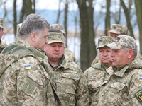 Ukrainian President PETRO POROSHENKO talks with Ukrainian servicemen during his visit of the military unit in Devichki settlement, about 85...