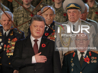President Petro Poroshenko sings the Anthem of Ukraine together with Soviet and Insurgent Armies veterans during the event. Action 