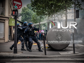 French Riot Police charge during a protest after the French government made use of the constitution's Article 49-3 allowing them to bypass p...