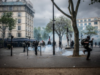 Demonstrators during a protest after the French government made use of the constitution's Article 49-3 allowing them to bypass parliament to...