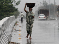 Heavy rain fall continuing in the eastern Indian state Orissa’s capital city Bhubaneswar on the effect of the cyclonic storm ‘Roanu’ that ap...