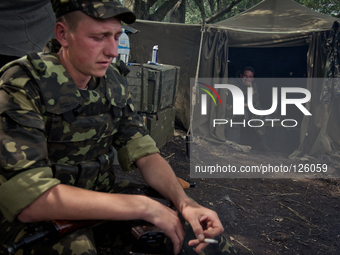 Ukrainian army paratroopers rest after patroling the territory of Anti-terrorist Opp Base in Donetsk region (Photo by Sergii Kharchenko/NurP...