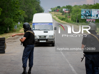 Police special opps check a van on the road to Donetsk (